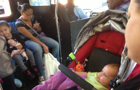 Maeve on Carrie's lap, taking the bus to the Bronx